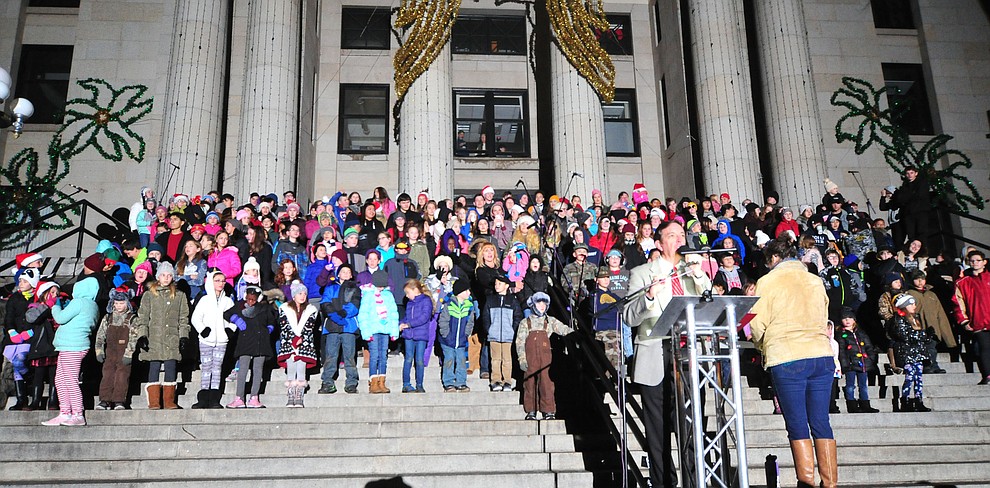 Children gather on the courthouse steps as part of the 64th Annual Christmas Yavapai County Courthouse Lighting in downtown Prescott Satuday, Dec. 1, 2018. (Les Stukenberg/Courier).