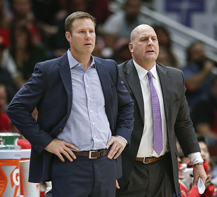 In this Oct. 21, 2017, file photo, Chicago Bulls head coach Fred Hoiberg, left, and his assistant Jim Boylen, right, look on from the sidelines during the first half of an NBA basketball game against the San Antonio Spurs, in Chicago. The Bulls fired Hoiberg Monday, Dec. 3, 2018. (Kamil Krzaczynski/AP, File)