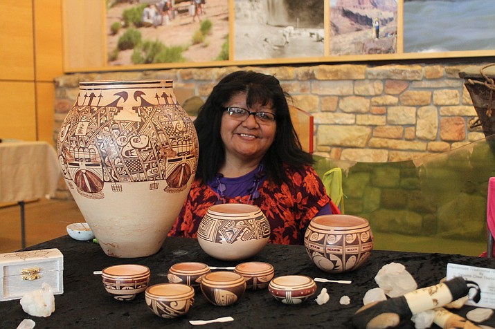 Delaine Tootsie-Chee demonstrates and displays Hopi pottery during Grand Canyon’s Native American Heritage Month celebration Nov. 14. (Erin Ford/WGCN)
