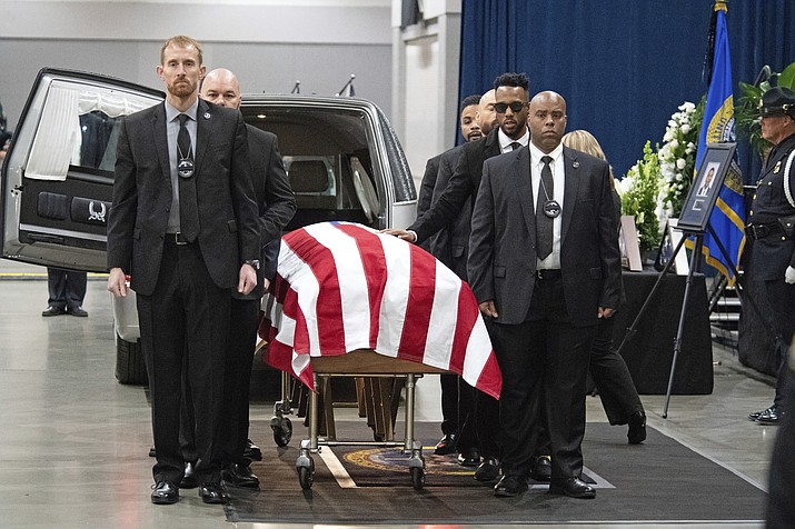 U.S. Marshals escort the casket inside the Tucson Convention Center in Tucson, Ariz., for the Celebration of Life ceremony for fallen U.S. Marshal Deputy Chase White on Friday, Dec. 7, 2018. White was shot and killed while serving an arrest warrant on Nov. 29. (Shane T. McCoy/U.S. Marshals Service via AP)