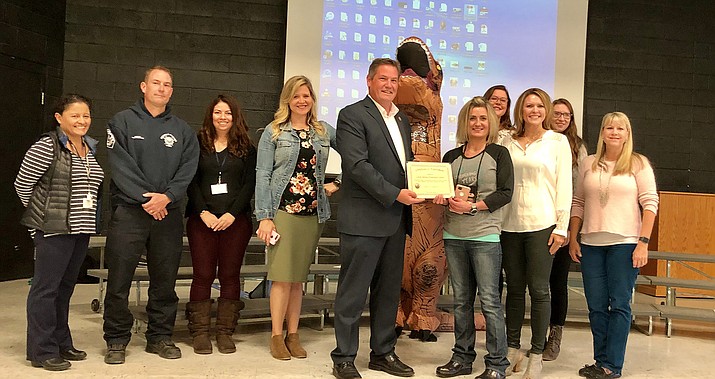 Yavapai County Supervisor Jack Smith, and representatives from the Yavapai County Health Department, MATForce, North Star Youth Partnerships and the Central Yavapai Fire District present a certificate to Coyote Springs Elementary. (Courtesy)
