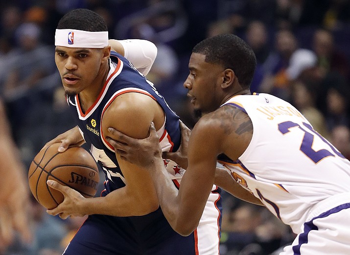 Los Angeles Clippers forward Tobias Harris, left, looks to pass as Phoenix Suns forward Josh Jackson (20) defends during the first half of an NBA basketball game, Monday, Dec. 10, 2018, in Phoenix. (Matt York/AP)