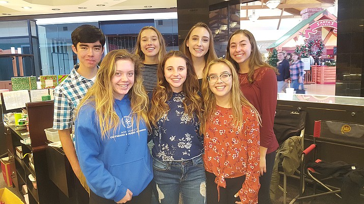 Ready to wrap are, front row, left to right, Abigail Macdonald, Hailey Olague and Neida Del Real; back row, Ethan Krafft, Tate Coggins, Audrey Guess and Natalie D’Angelo. (Doug Graham/Courier)
