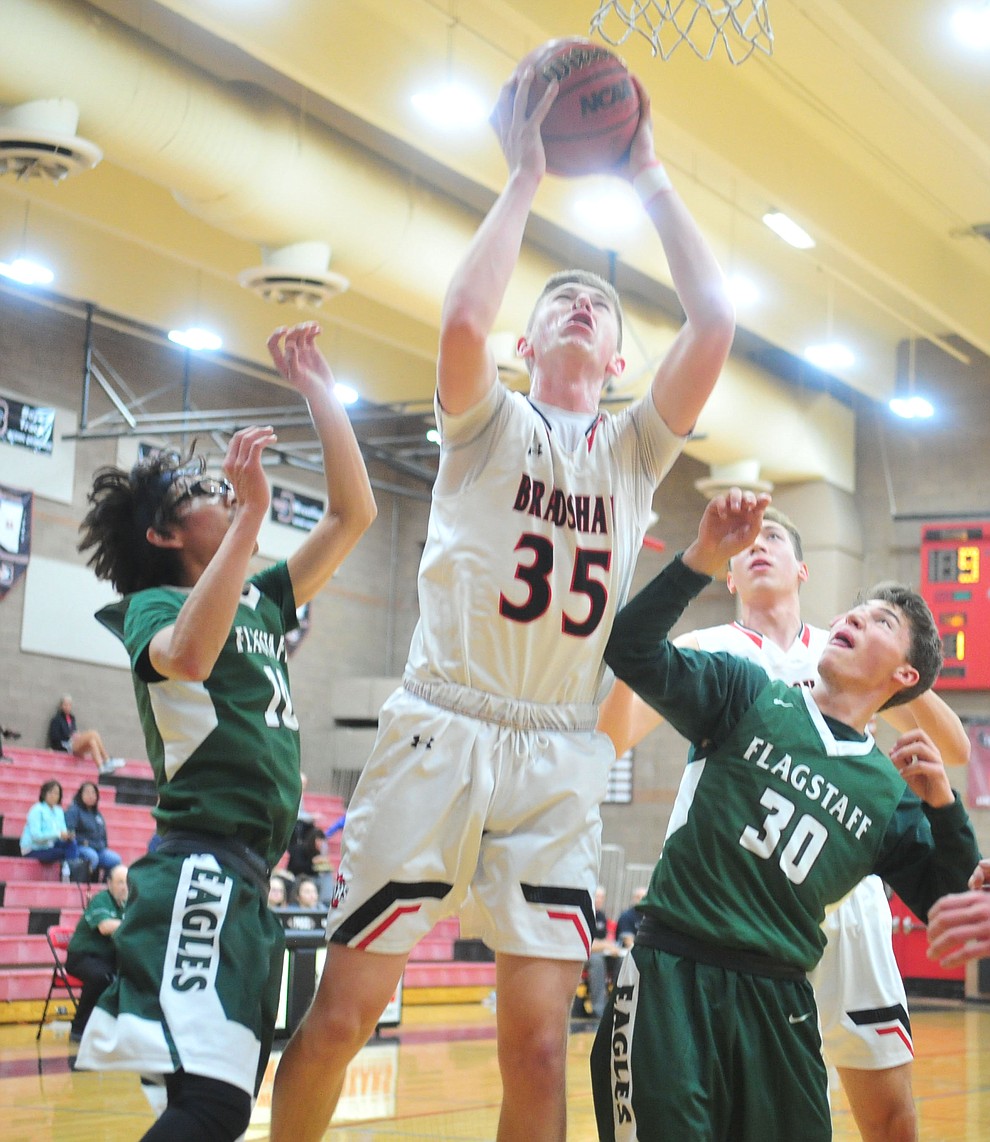 Bradshaw Mountain's Nate Summit puts back a rebound as the Bears take on the Flagstaff Eagles Tuesday, Dec. 11, 2018 in Prescott Valley. (Les Stukenberg/Courier).