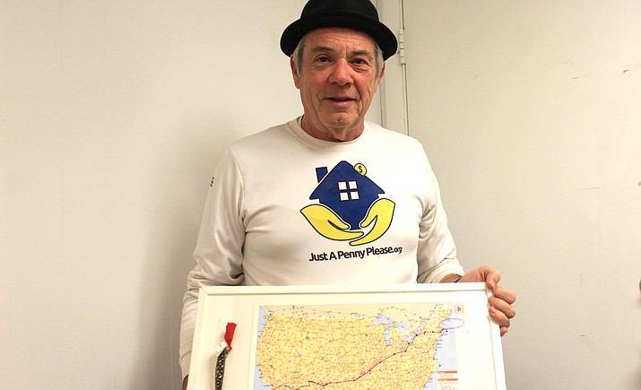 Michael Capozzoli displays a map of his route across the country. He is raising money to build a shelter for survivors of domestic violence and abuse. VVN/Kelcie Grega