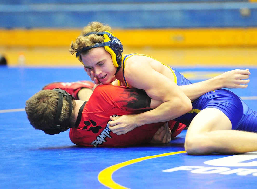 Prescott's Colton Tomitz works on Coconino's Payton Polder Wednesday, Dec. 12, 2018 in Prescott. (Les Stukenberg/Courier).