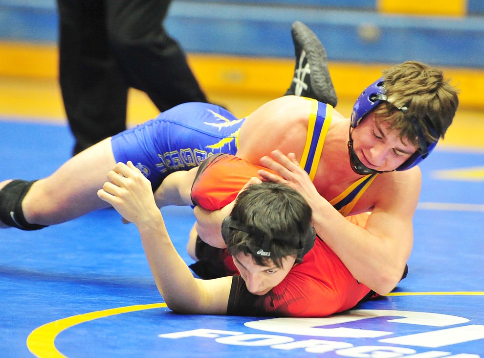 Prescott's Andrew Salberg works on Coconino's Kyle Munoz Wednesday, Dec. 12, 2018 in Prescott. (Les Stukenberg/Courier).
