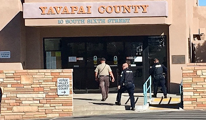 Cottonwood police and other area emergency responders evacuate the Yavapai County Annex in Cottonwood shortly after noon today, Dec. 13, following a report of a bomb in the assessor's office. (Vyto Starinskas, Verde News/Courtesy)