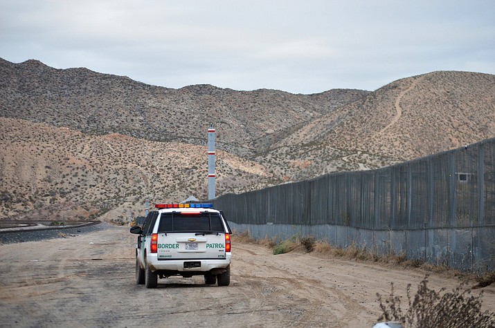 In this Jan. 4, 2016, file photo, a U.S. Border Patrol agent patrols Sunland Park along the U.S.-Mexico border next to Ciudad Juarez. A 7-year-old girl who had crossed the U.S.-Mexico border with her father, died after being taken into the custody of the U.S. Border Patrol, federal immigration authorities confirmed Thursday, Dec. 13. (AP Photo/Russell Contreras, File)