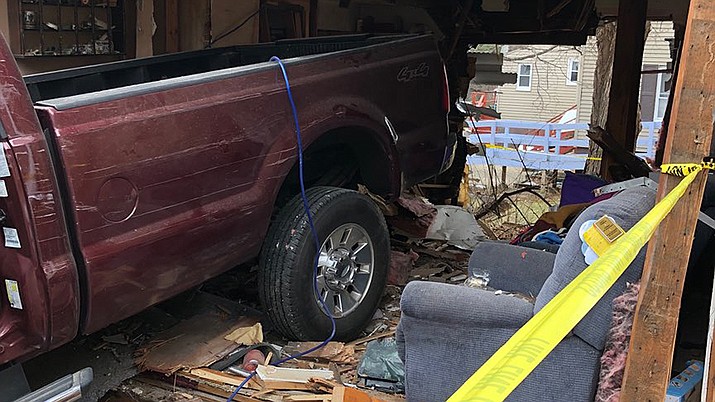 Tracy Samuels was sleeping on the couch in her Massachusetts home Thursday when she heard a loud bang. She woke up and said, “Why is there a truck in my living room?” (Templeton Police Department)