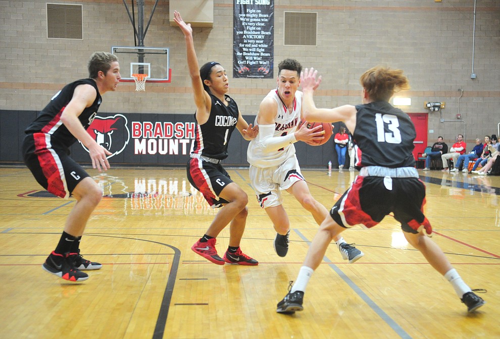 Bradshaw Mountain's Carter John drives between defenders as the Bears hosted Coconino in a doubleheader hoops matchup Saturday, Dec. 15, 2018 in Prescott Valley. (Les Stukenberg/Courier).