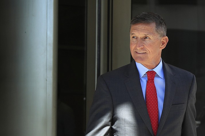 Former Trump national security adviser Michael Flynn leaves federal courthouse in Washington, following a status hearing Tuesday, July 10, 2018. Flynn is relaxed and hopeful even as the possibility of prison looms when he's sentenced in the Russia probe Tuesday, Dec. 18, 2018. (Manuel Balce Ceneta/AP, File)