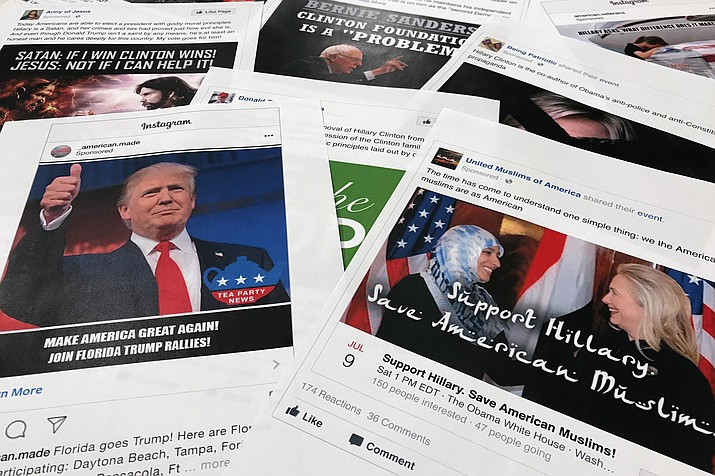 Some of the Facebook and Instagram ads linked to a Russian effort to disrupt the American political process and stir up tensions around divisive social issues, released by members of the U.S. House Intelligence committee, are photographed in Washington, on Wednesday, Nov. 1, 2017.  (AP Photo/Jon Elswick)