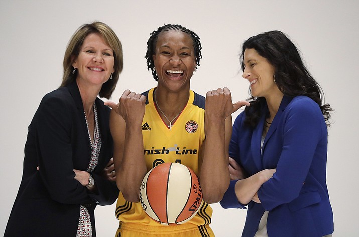 In this May 9, 2016, file photo, Indiana Fever's Tamika Catchings jokes with head coach Stephanie White, right, and Kelly Krauskopf, president and general manager, during WNBA basketball media day in Indianapolis. The Indiana Pacers have hired Kelly Krauskopf as their new assistant general manager, making her the first woman in league history to hold the title. Krauskopf has a long history with the franchise. She spent 19 seasons as the top executive of the WNBA's Indiana Fever and helped oversee Indiana's new NBA2K league team. (Darron Cummings/AP, File)