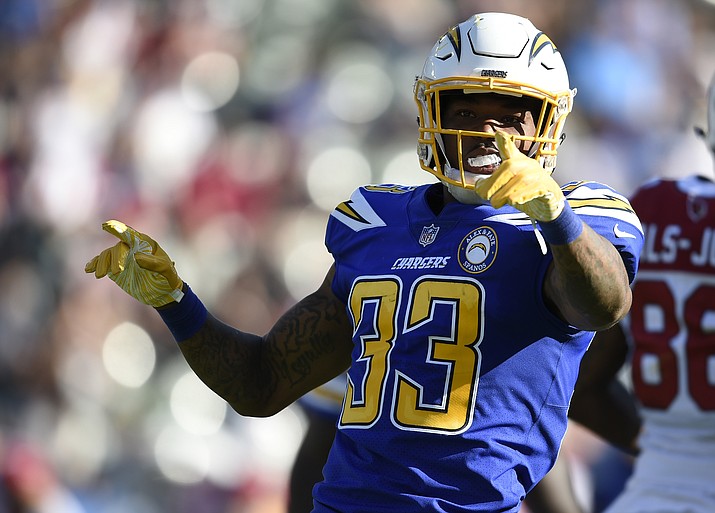 In this Nov. 25, 2018 file photo Los Angeles Chargers free safety Derwin James (33) gestures after intercepting a pass from Arizona Cardinals quarterback Josh Rosen during the first half of an NFL football game in Carson, Calif. The Los Angeles Chargers placed seven players in the Pro Bowl, including safety Derwin James, one of six rookies across the league to make the game, which will be played Jan. 27 in Orlando. (Kelvin Kuo/AP, file)