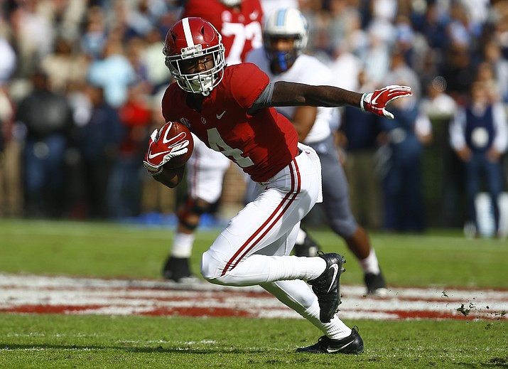 In this Nov. 17, 2018, file photo, Alabama wide receiver Jerry Jeudy (4) catches a pass against Citadel during the first half of a game in Tuscaloosa, Ala. Jeudy was named to the 2018 AP All-America NCAA college football team, Monday, Dec. 10, 2018. (Butch Dill/AP, file)