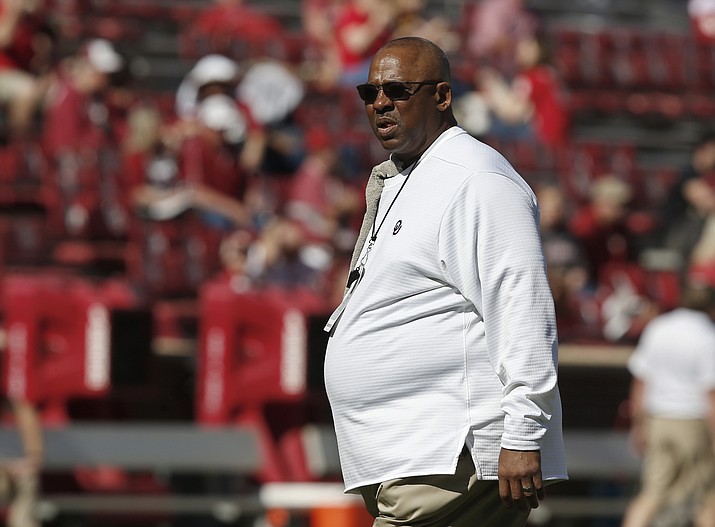 Oklahoma defensive coordinator Ruffin McNeill watches players before an NCAA college football game between Kansas State and Oklahoma. The Sooners played so poorly in a 48-45 regular-season loss to Texas that they fired defensive coordinator Mike Stoops. The numbers actually got worse under McNeill, but the past two games offered glimmers of hope. (Sue Ogrocki/AP, File)