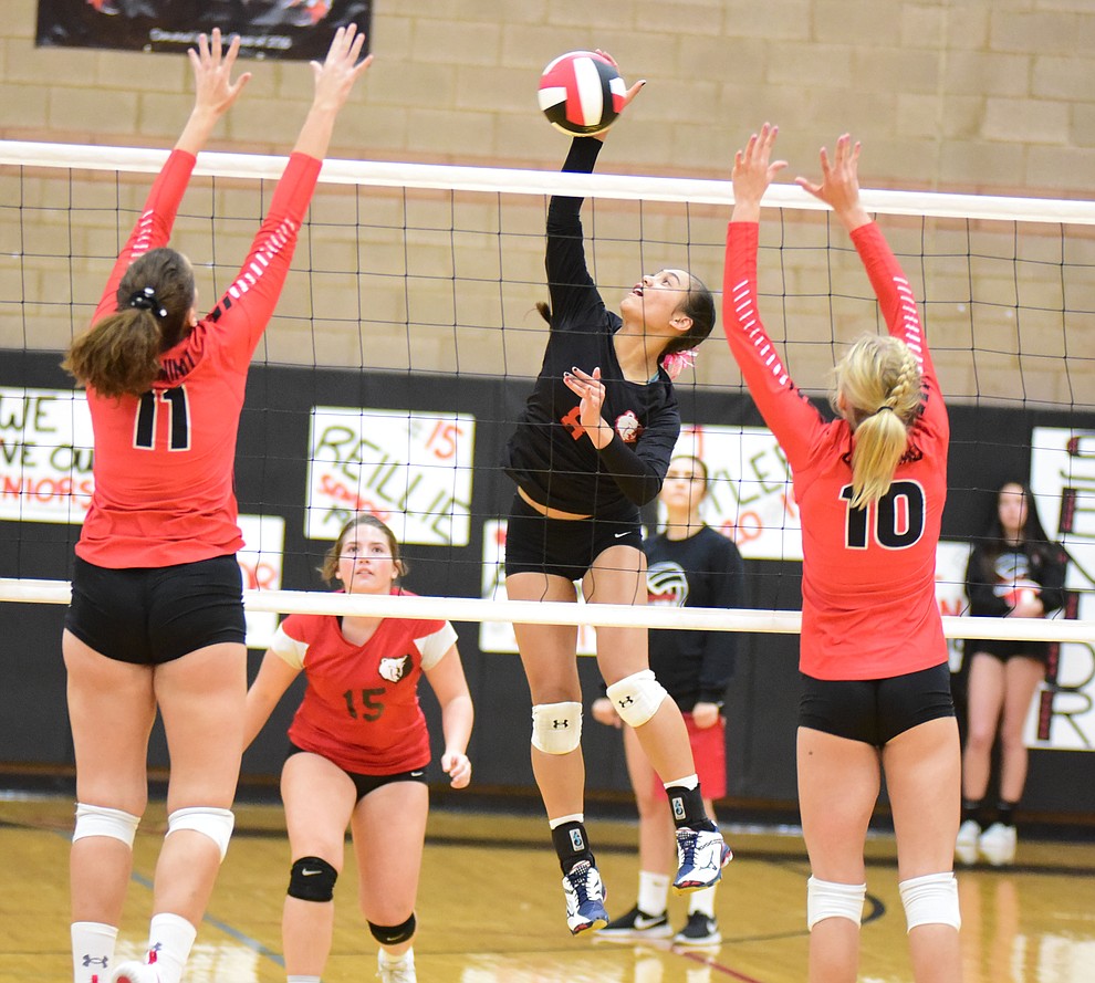Bradshaw Mountain's Mailani Manuel sends a kill between a pair of defenders as the Bears host Coconino Thursday, Oct. 11, 2018 in Prescott Valley. (Les Stukenberg/Courier)