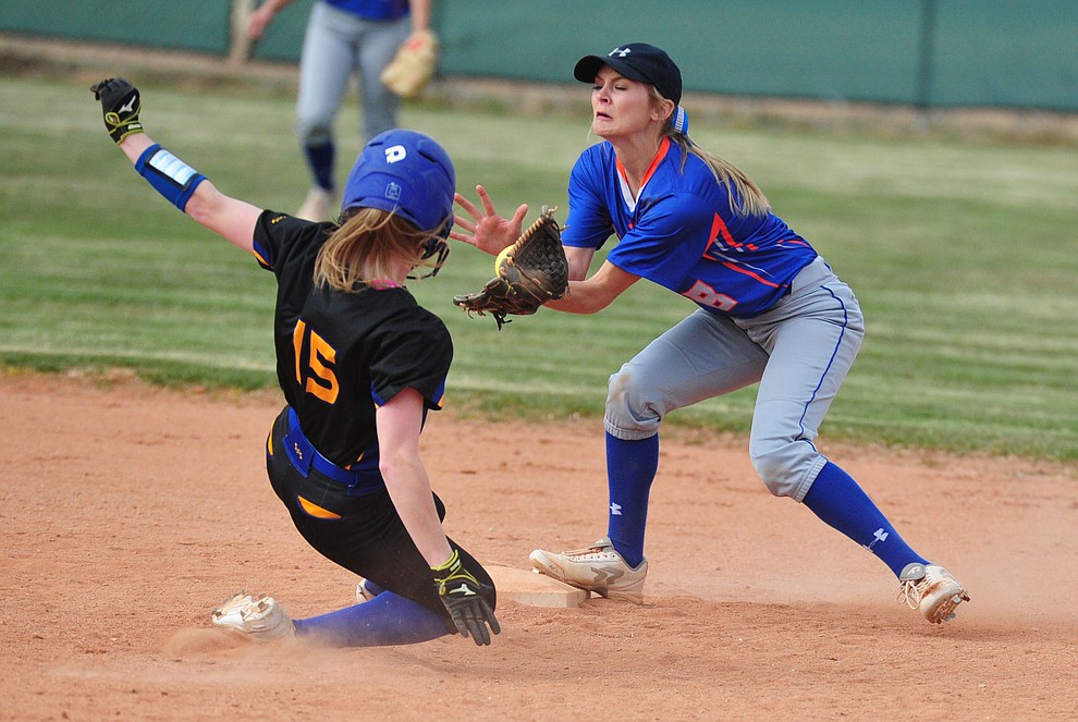 Chino Valley's Jadyn Clawson gets the out on Anastasia Tanner as the Cougars hosted the Kingman Bulldogs Tuesday, March 19, 2018 in Chino Valley. (Les Stukenberg/Courier)