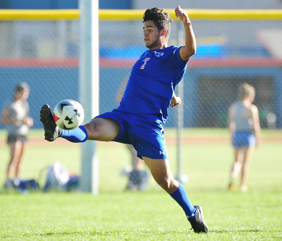 Chino Valley's Jordan Sanchez takes the ball in the air as the Cougars take on Leading Edge in boys soccer Wednesday, Sept. 26, 2018 in Chino Valley.(Les Stukenberg/Courier)