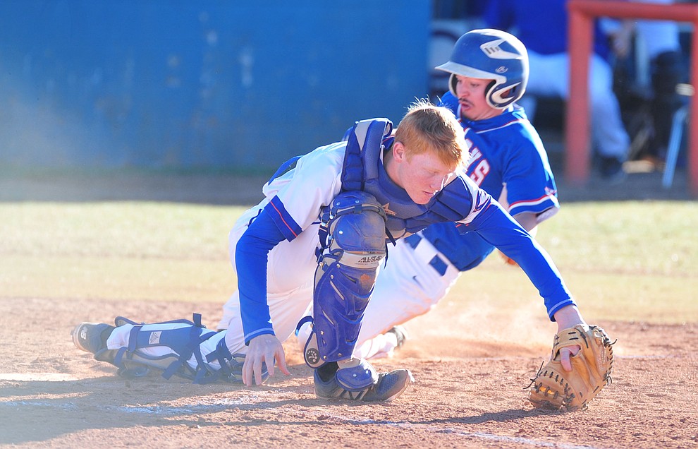 Chino Valley's JR Willingham tries to make a play at home on Camp Verde's Kelton O'Grady as the Cougars take on the Camp Verde Cowboys in baseball Monday in Chino Valley. (Les Stukenberg/Courier)