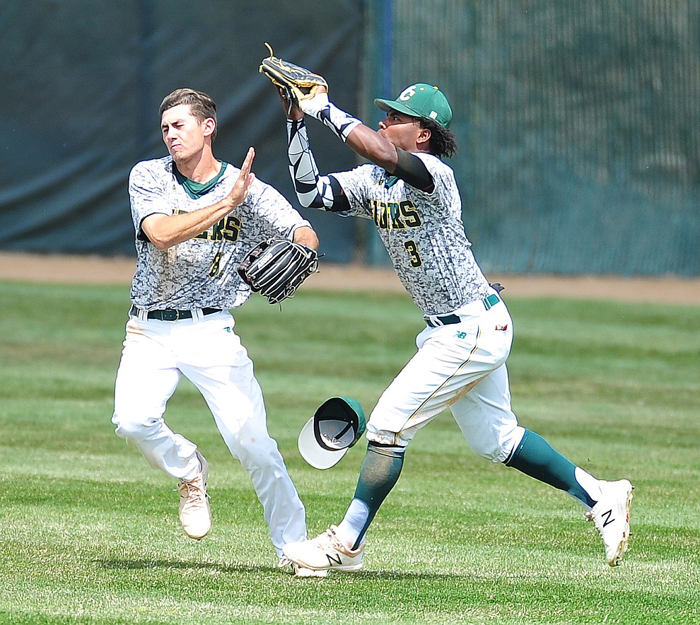 Yavapai's Gianni Tomasi and Over Torres go for a fly ball as the Roughriders host Glendale Community College in the first game of a doubleheader Tuesday, April 3, 2018. (Les Stukenberg/Courier)