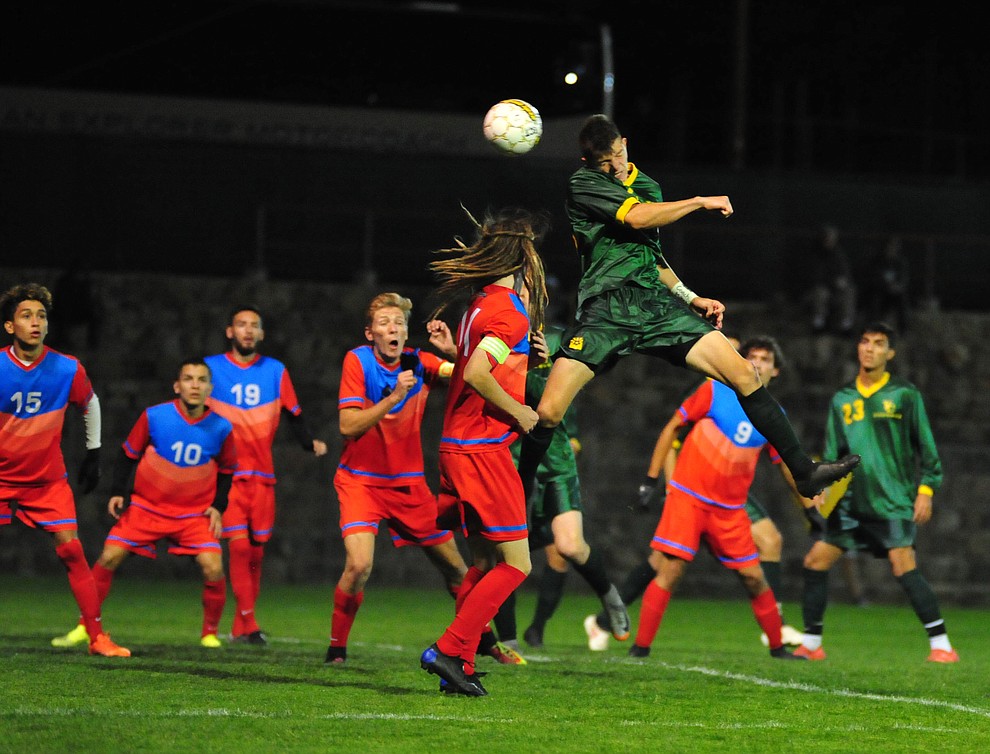 Yavapai's Andrew Rivera heads the ball towards the goal as the Roughriders played Mesa Community College in the NJCAA Region One playoff Tuesday, Oct. 23, 2018 in Prescott.(Les Stukenberg/Courier)