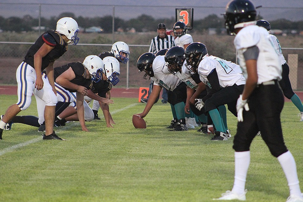 August 17 – The Kingman High School football team cruised to a 58-14 blowout of Pinon Friday night at KHS. Austin Dias led the way - passing for four touchdowns and adding three more on the ground.
