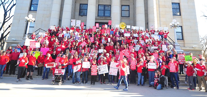 Hundreds of local teachers, students, family members and supporters marched around the Yavapai County Courthouse Plaza Wednesday, March 28, 2018, seeking more competitive pay and better benefits for educators in Yavapai County and Arizona. (Les Stukenberg/Courier, file)