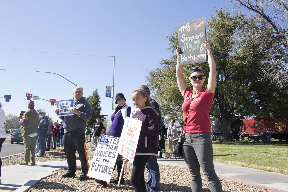 March 24 – Kayla Crowe, MCC student held her sign high at the March for Our Lives protest in Kingman, Saturday. Crowe said if we do need assault rifles to protect ourselves from foreign invasion then lets leave that to the trained military professionals. (Photo by Vanessa Espinoza/Daily Miner)