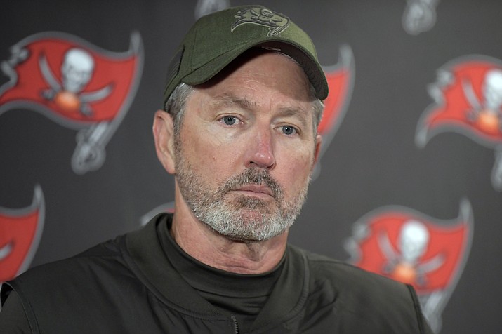 In this Sunday, Nov. 18, 2018 file photo, Tampa Bay Buccaneers head coach Dirk Koetter talks to reporters after an NFL football game against the New York Giants in East Rutherford, N.J.  Dirk Koetter has been fired as coach of the Tampa Bay Buccaneers. The team made the announcement Sunday night, Dec. 30, 2018 a little more than three hours after the Bucs concluded a disappointing season with a 34-32 loss to the Atlanta Falcons. (Bill Kostroun/AP, file)