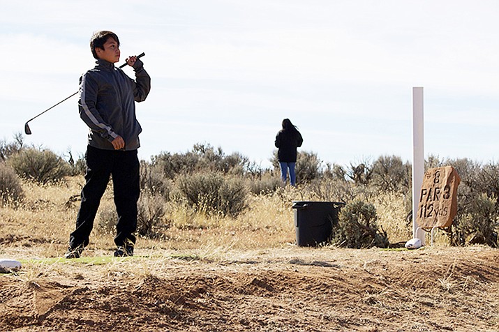 Rez golf is growing in popularity among the Navajo, but few outsiders know of it. More community elders and rez golfers are sharing the experience with children. (Photo by Jake Goodrick/Cronkite News)