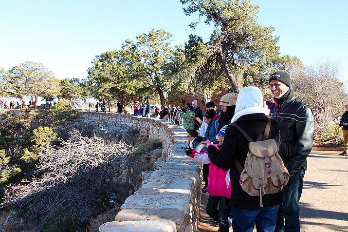 Holiday crowds at Grand Canyon National Park were consistent in spite of a partial government shutdown that has left the park largely unstaffed. Visitors were packed along the South Rim outside the El Tovar Hotel Dec. 26. (Erin Ford/WGCN)