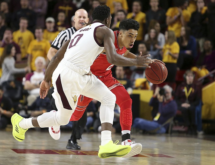 Utah guard Sedrick Barefield, right, advances the ball up court as Arizona State's Luguentz Dort (0) defends during the first half of an NCAA college basketball game, Thursday, Jan. 3, 2019, in Tempe, Ariz. (Ralph Freso/AP)