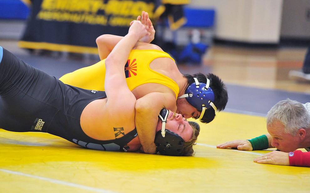 Embry Riddle's Carlos Apodaca pins Wyatt Kesler as the Eagles take on the Western Pacific Knights in a wrestling dual Monday afternoon in Prescott. (Les Stukenberg/Courier).