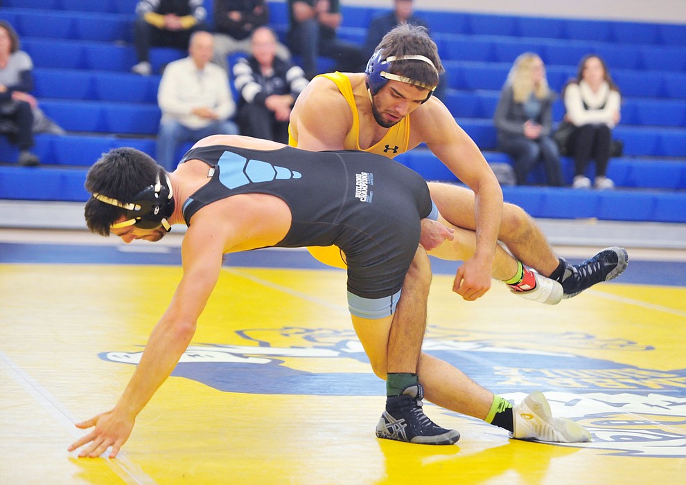 Embry Riddle's James Williams, right, wrestles Chas Peterson as the Eagles take on the Western Pacific Knights in a wrestling dual Monday afternoon in Prescott. (Les Stukenberg/Courier).