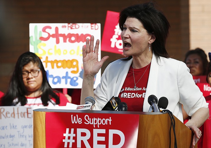 In this April 25, 2018 file photo NEA President Lily Eskelsen Garcia speaks at the #RedForEd Walkout, March and Rally news conference Phoenix. After massive walkouts over teacher salaries and school funding inspired many teachers to run for office, the reality of November's results are coming into focus. (Ross D. Franklin/AP, file)