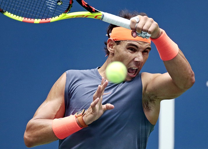 In this Sept. 7, 2018, file photo, Rafael Nadal of Spain,returns a shot to Juan Martin del Potro of Argentina during the semifinals of the U.S. Open tennis tournament in New York. Nadal is one of the men to keep an eye on at the Australian Open, Jan. 14-27, 2019.(Andres Kudacki/AP, file)