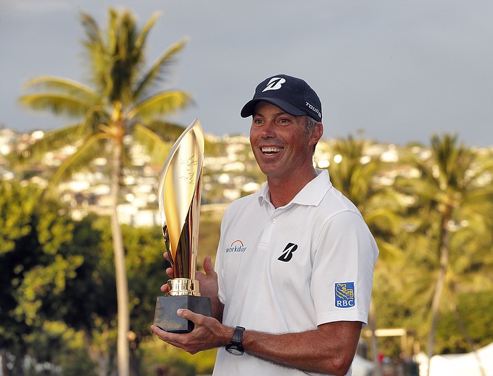 Matt Kuchar holds the champions trophy after the final round of the Sony Open PGA Tour golf event, Sunday, Jan. 13, 2019, at Waialae Country Club in Honolulu. (Matt York/AP)