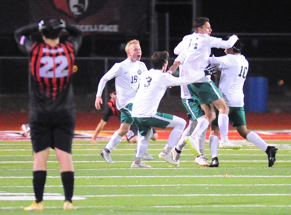 Flagstaff players celebrate their goal in the 9th minute of the second overtime against Bradshaw Mountain Wednesday Jan. 16, 2019 in Prescott Valley. (Les Stukenberg/Courier).