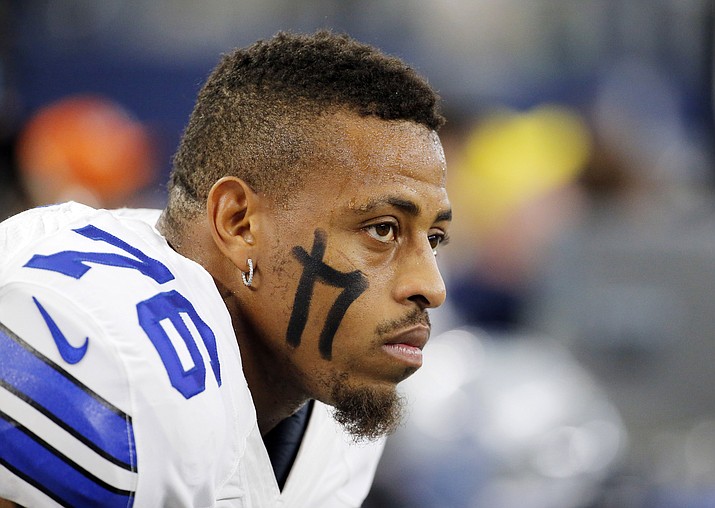 In this Sunday, Nov. 1, 2015, file photo, Dallas Cowboys defensive end Greg Hardy watches from the sideline during an NFL football game against the Seattle Seahawks in Arlington, Texas.  Hardy tweeted "regret" on Saturday night, Nov. 7, after photos of his bruised ex-girlfriend from his domestic violence case were released by Deadspin a day earlier. Hardy said on Twitter that he "had to say I express my regret 4 what happened in past" and that he's "dedicated to being the best person & teammate that I can be." He also said he was grateful to still be playing in the NFL. (Brandon Wade/AP, File)