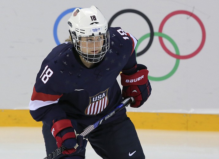 In this Feb. 10, 2014, file photo, Lyndsey Fry of the United States skates during the 2014 Winter Olympics women's ice hockey game against Switzerland, at Shayba Arena in Sochi, Russia. Fry grew up in Arizona, where resources and opportunities for hockey were scarce. She managed to overcome the obstacles to play hockey at Harvard and earn an Olympics silver medal. Now Fry is back where she started, helping the Arizona Coyotes build their youth hockey programs to give kids opportunities she never had. (J. David Ake/AP, file)