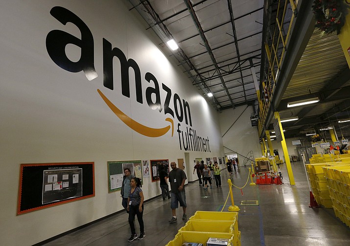 Employees at the Amazon.com Fulfillment Center Monday, Dec. 2, 2013, in Phoenix. (Ross D. Franklin/AP,file)