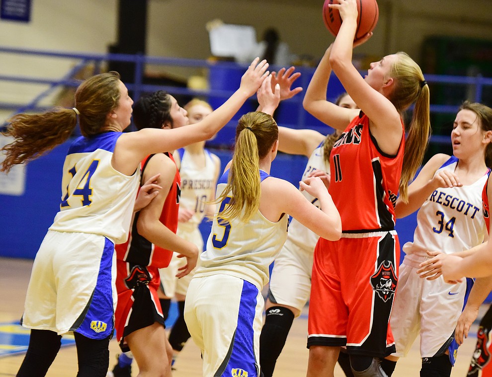 Mingus' Chayce Doerksen gets a shot off surrounded by defenders as the Marauders take on the Prescott Badgers Friday Jan. 18, 2019 in Prescott. (Les Stukenberg/Courier).