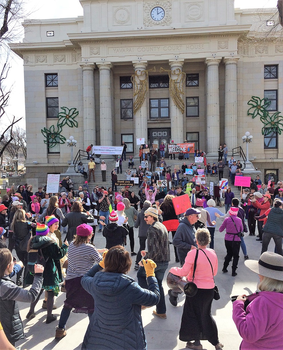 Participants perform a lively flash mob dance on the Yavapai County Courthouse during the Yavapai County Women March On event Jan. 19, 2019. (Sue Tone/Courier)