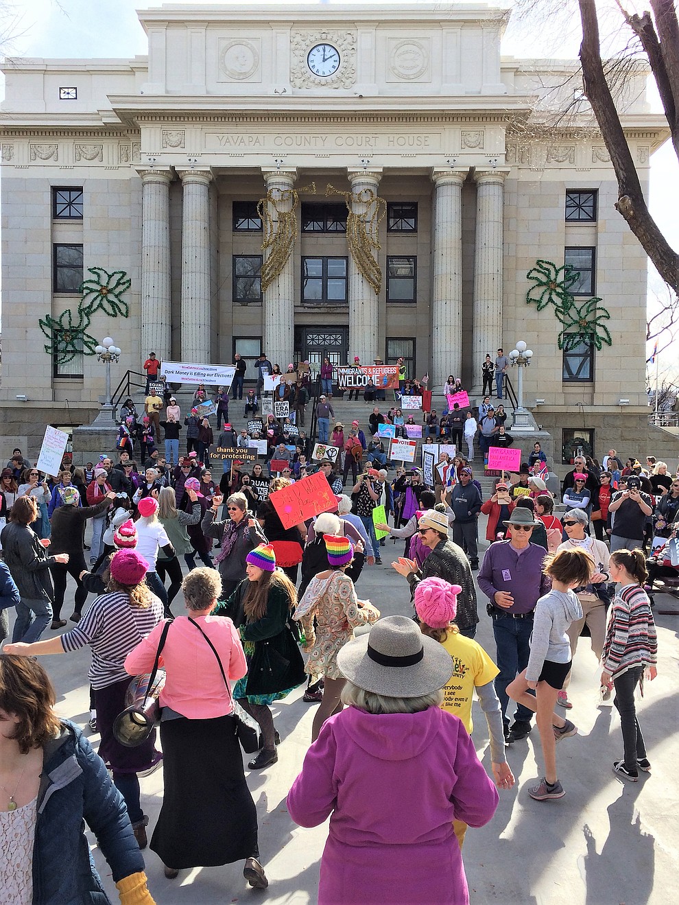 Participants perform a lively flash mob dance on the Yavapai County Courthouse during the Yavapai County Women March On event Jan. 19, 2019. (Sue Tone/Courier)