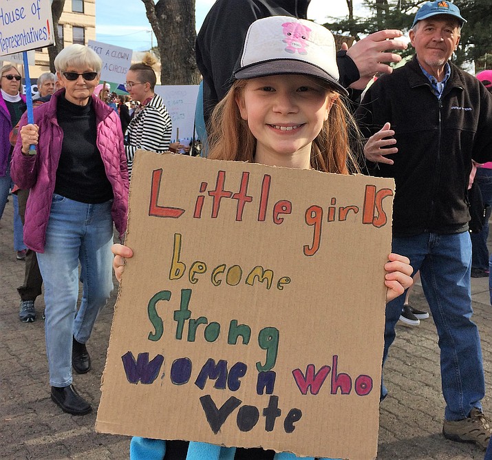 Why are you here today? Eva Pagliasotti, 11, Prescott, with her homemade sign. “I’m just making a statement.” (Sue Tone/Courier)