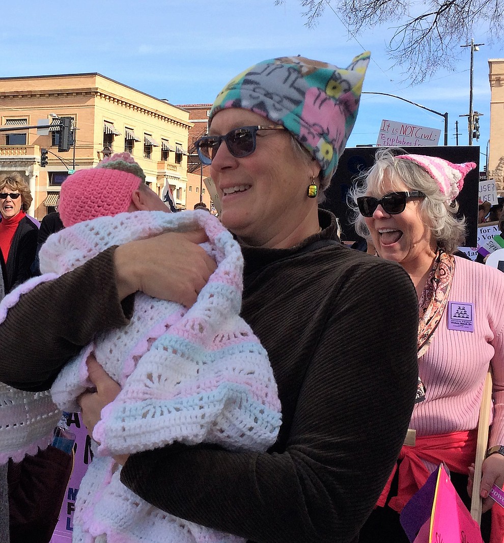 Why are you here today? Abby Brill with grand-niece, Adelaide. “It’s her first march. I want her life to be freer, fuller and more empowered than ours has been.” (Sue Tone/Courier)