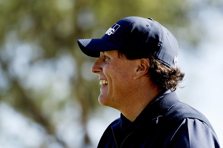 Phil Mickelson smiles after his tee shot on the fourth hole during the third round of the Desert Classic golf tournament on the Stadium Course at PGA West on Saturday, Jan. 19, 2019, in La Quinta, Calif. (Chris Carlson/AP)