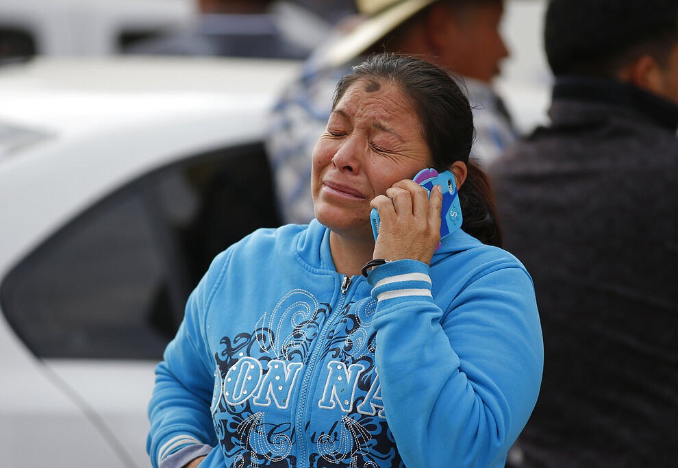 A woman cries outside a funeral service in Tula, Hidalgo state, Mexico, Saturday, Jan. 19, 2019. A massive fireball that engulfed people scooping up fuel spilling from a pipeline ruptured by thieves in central Mexico killed multiple people and badly burned others. (AP Photo/Claudio Cruz)
